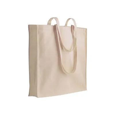 Geantă de mână în culori uni, confecționată din bumbac reciclat de 280 g/m². Cu pliu lateral din poliester